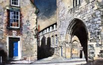 The ancient medieval arched entrance to the College an area behind the Cathedral which is the home of the clergy and the Chorister School. The staircase to the Cathedral Chapter Office can just be made out in the shadows of the passage in the centre of view which also leads to the Cathedral workshops. Part of the 2014 Durham Cathedral Exhibition.